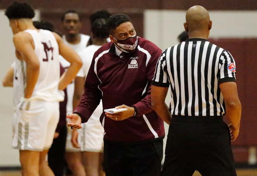 Plano Senior High School head coach Dean Christian questions a ref during a time out in the...