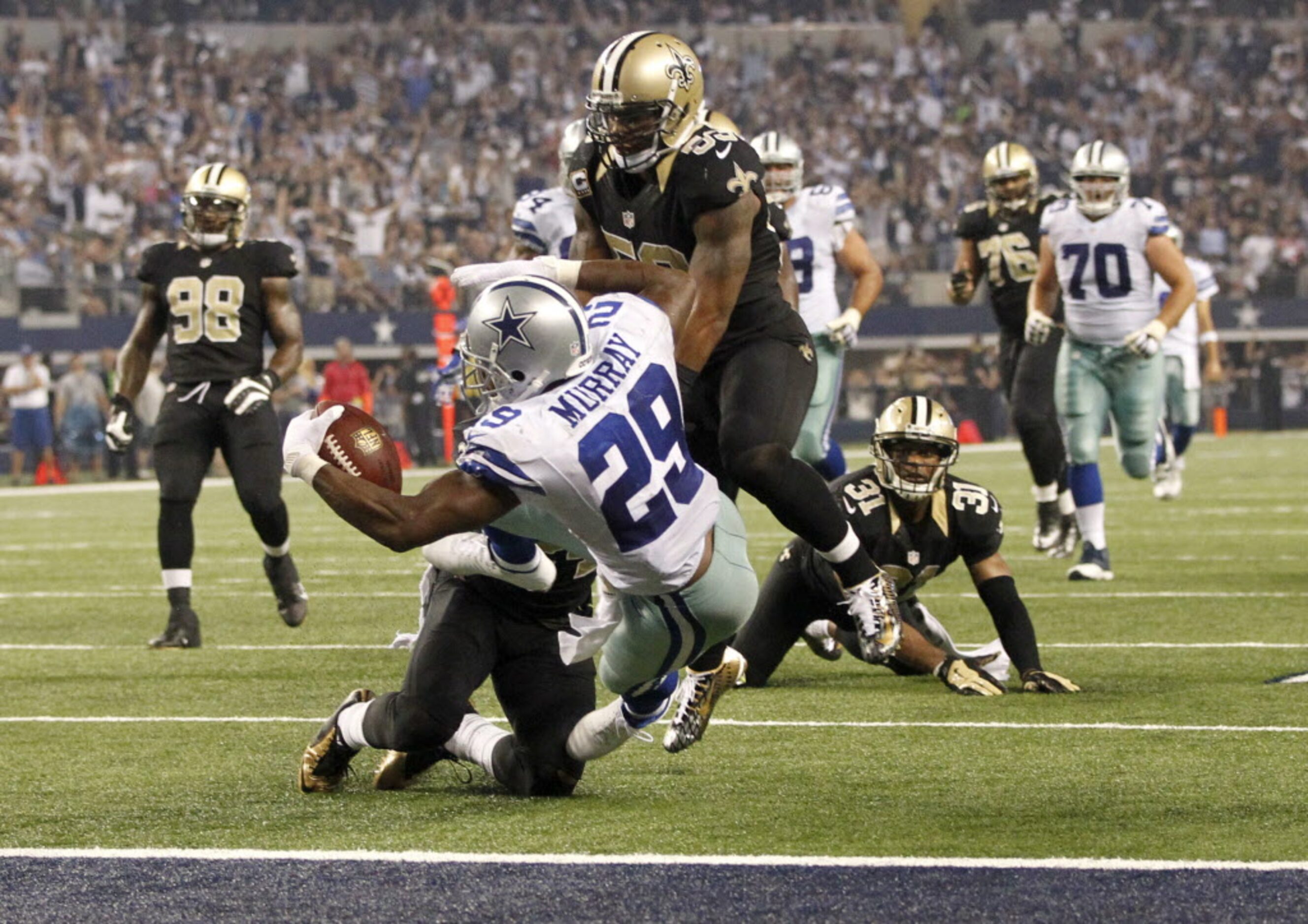 Dallas Cowboys running back DeMarco Murray (29) dives in for the touchdown as New Orleans...