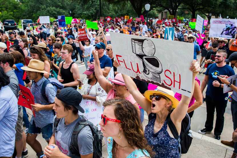 Protestors chant during a One Texas Resistance rally on the south steps of the capitol on...