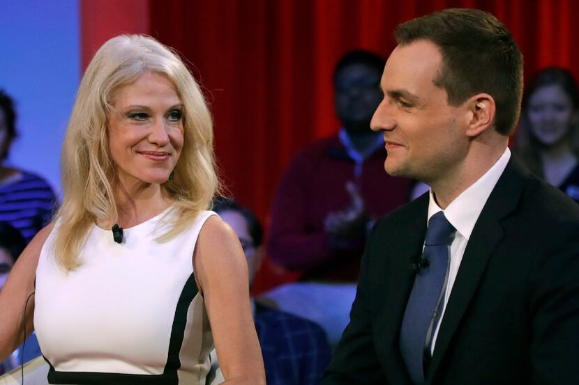 Kellyanne Conway, Trump-Pence campaign manager, left, looks towards Robby Mook,...