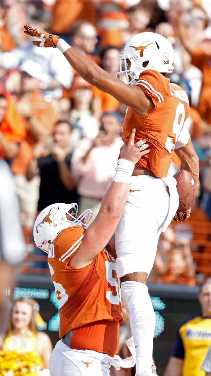Texas Longhorns wide receiver Collin Johnson (9)celebrates a touchdown with offensive...