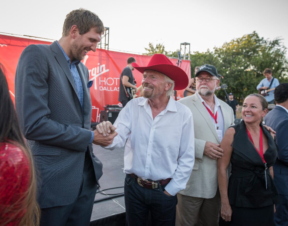 Dallas Mavericks Dirk Novitzki greets Richard Branson during the ground breaking for his...