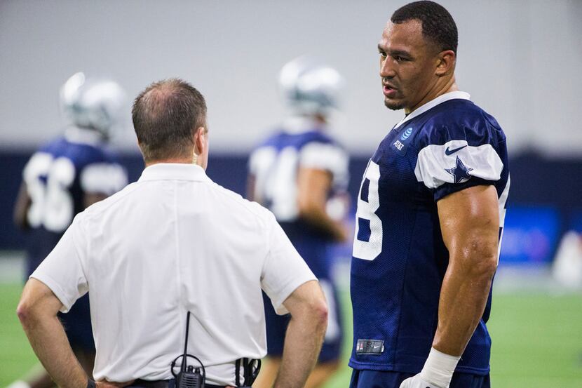 Dallas Cowboys defensive tackle Tyrone Crawford (98) chats on the sideline during a Dallas...