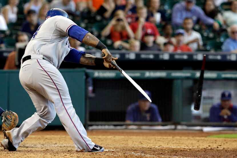 Texas Rangers' Prince Fielder breaks his bat on a ground-out to end a baseball game against...