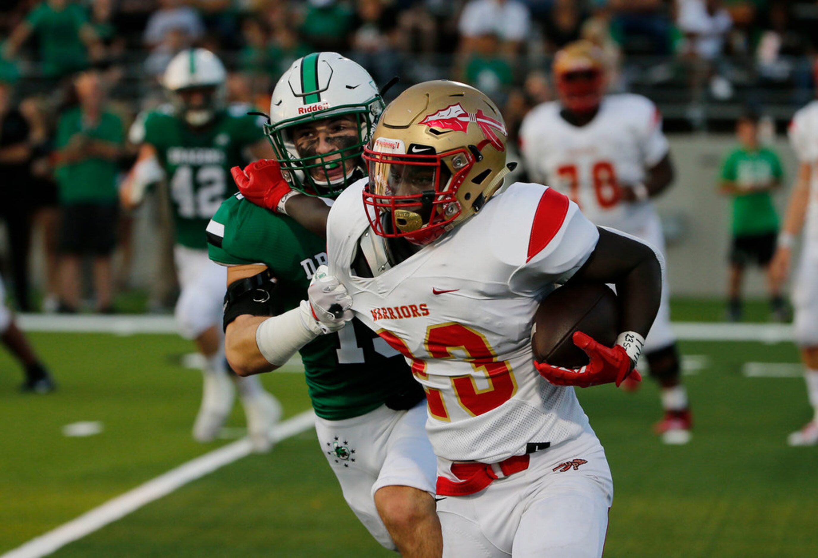 Southlake's Brandon Howell (15) tackles South Grand Prairie's Javarius Crawford (23) during...