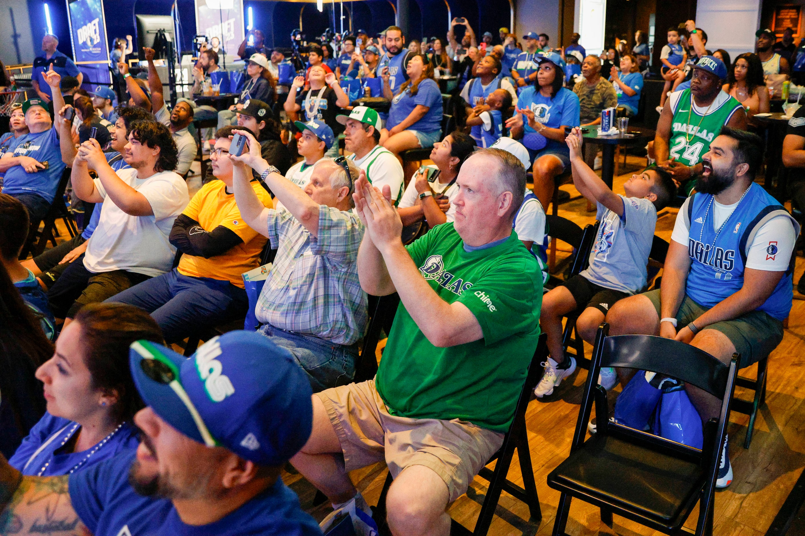 Dallas Mavericks fans react after the Mavericks selected Dereck Lively II at No. 12 after...