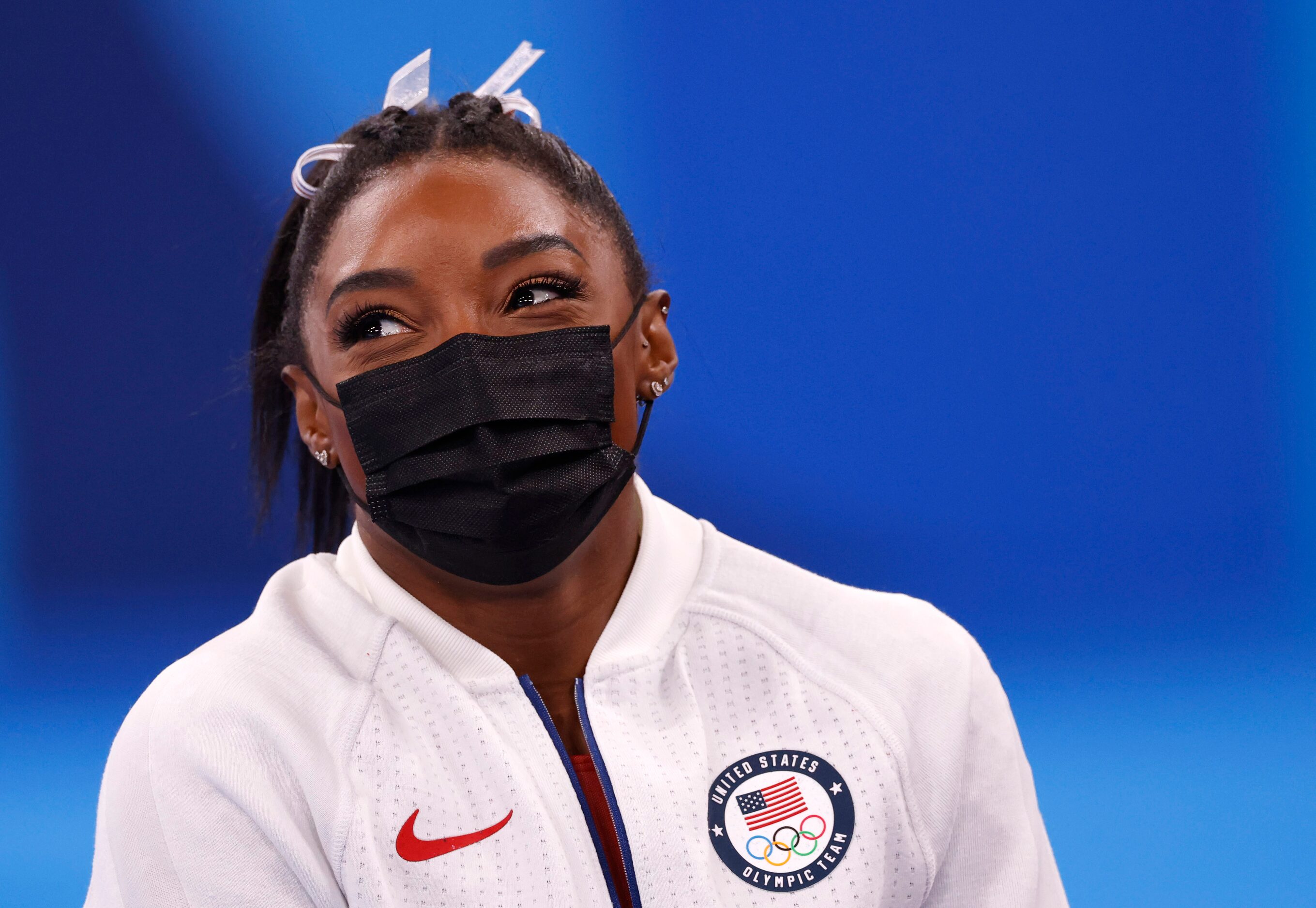 USA’s Simone Biles watches after pulling out of the competition after the vault event during...