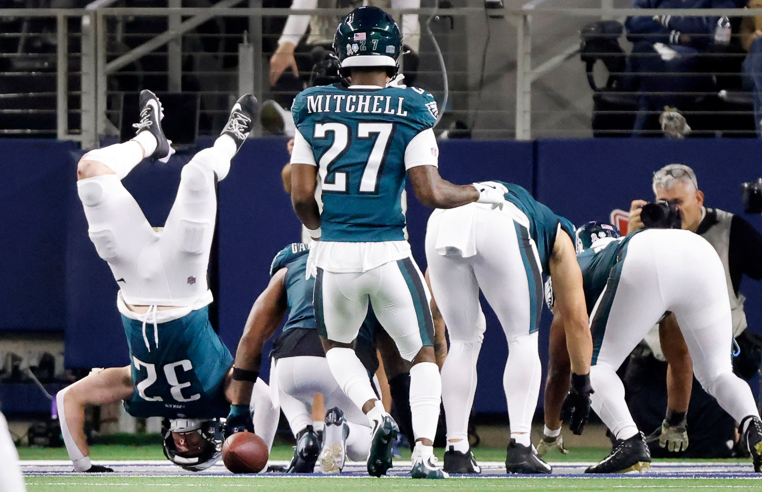 Philadelphia Eagles safety Reed Blankenship (32) does a handstand in the end zone after he...