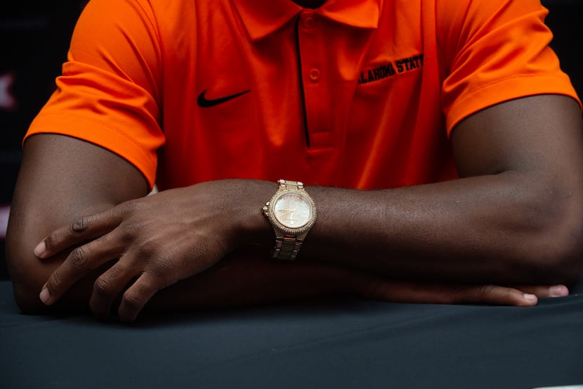 Oklahoma State University football cornerback A.J. Green wears a Michael Kors watch during...