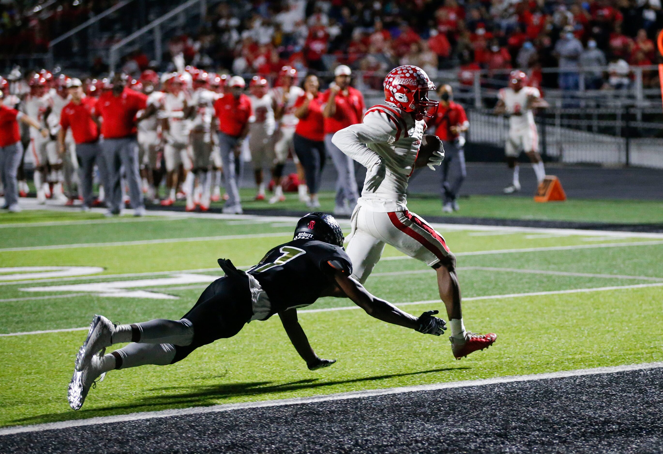 Terrell junior Kanye Nix, right, scores a touchdown as Kaufman sophomore defensive back...