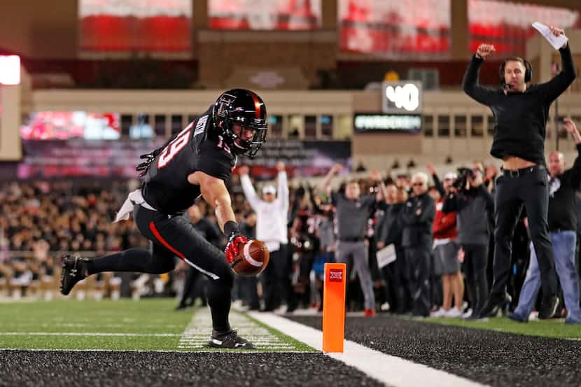 Texas Tech's Zach Austin (19) scores a touchdown during the second half of the team's NCAA...
