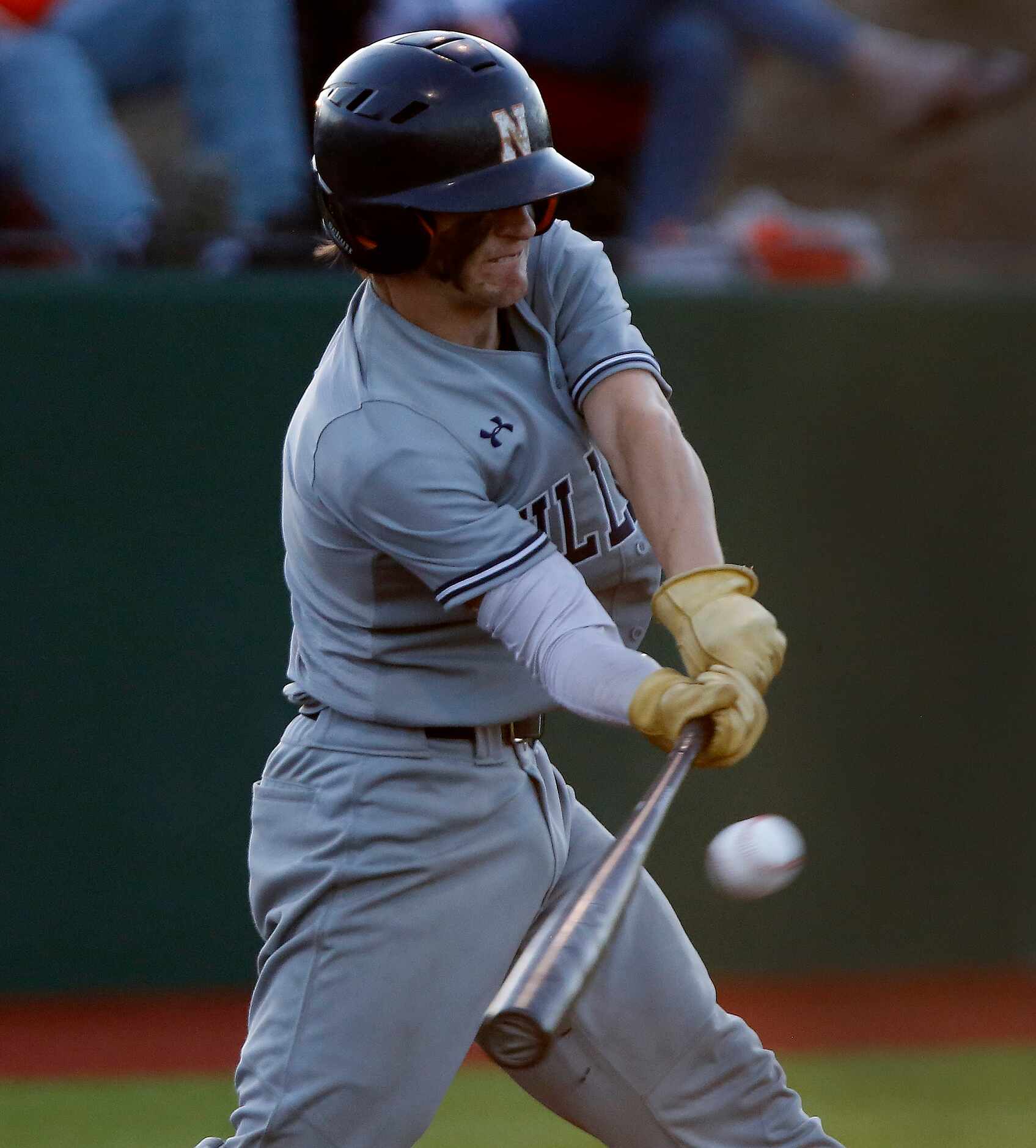 McKinney North High School catcher Cameron Bonds (3) gets a hit in the fourth inning during...