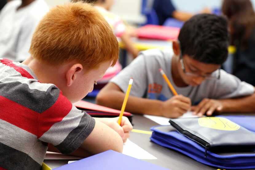 Fifth-graders at a North Texas area school work on their writing skills in anticipation of...