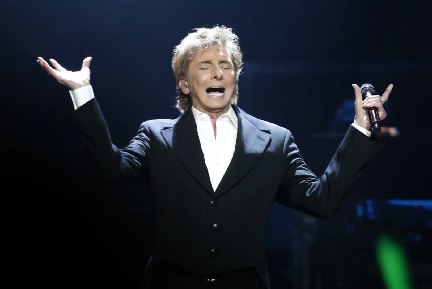 Barry Manilow performs onstage at American Airlines Center in Dallas, Thursday, Feb. 18,...