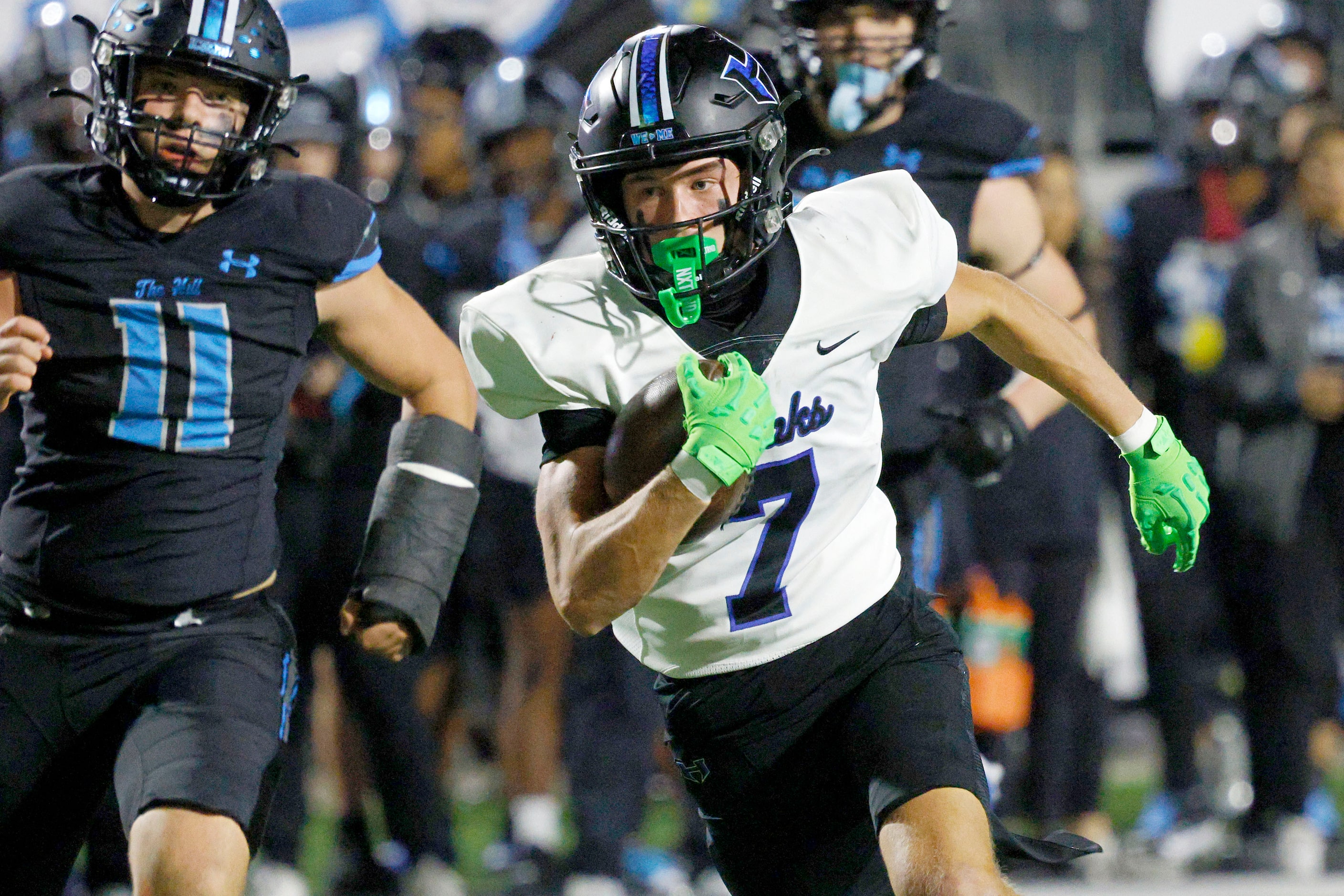 Hebron's Tyler Hoke (7) runs for a touchdown as Rock Hill's Max Wrobel (11) follows him in...