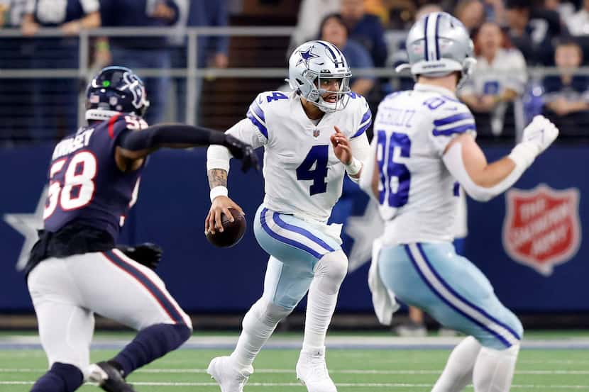 Dallas Cowboys quarterback Dak Prescott (4) keeps the ball and looks to get a first down...