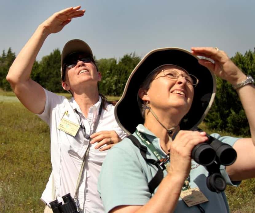 
Carolyn Gritzmaker and Eileen Berger try to identify a bird while on a recent tour of...