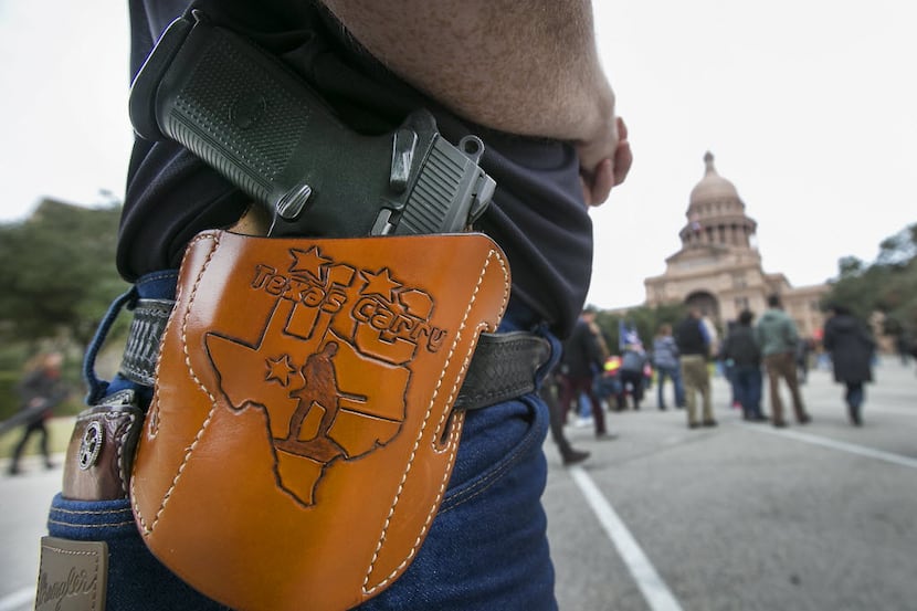 
Open-carry advocates, who did not want to be identified by name, brought their firearms to...