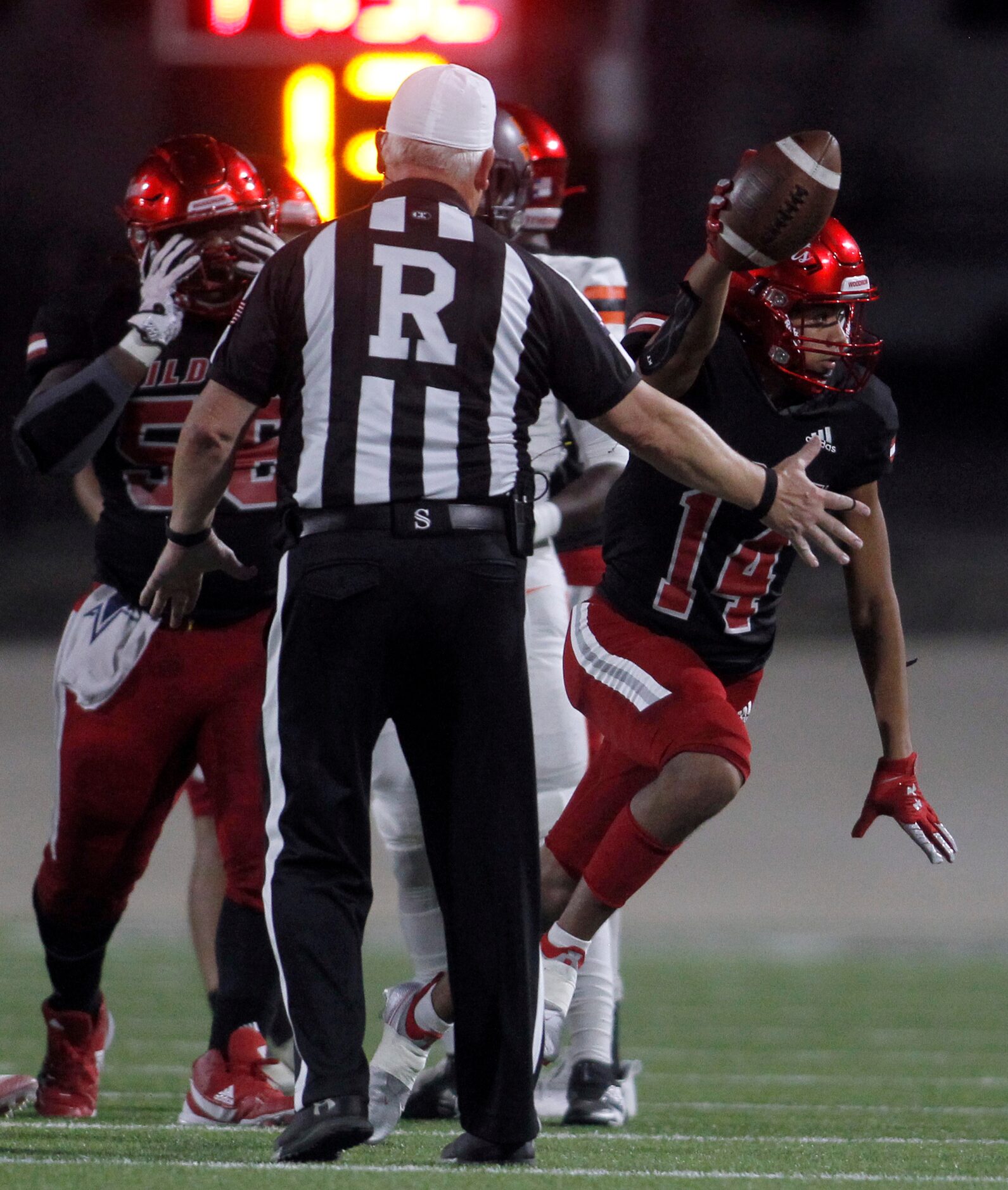 Dallas Woodrow Wilson defensive back Ricky Villalobos (14) celebrates a 2nd quarter fumble...