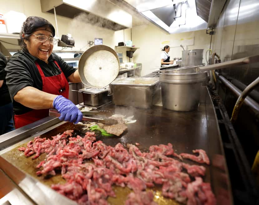 Maria Tapia makes fajitas at Cuquita’s in Farmers Branch on Aug 12, 2024.