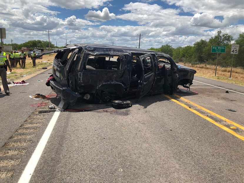 A heavily damaged SUV is seen on Texas Highway 85 in Big Wells, Texas, after crashing while...