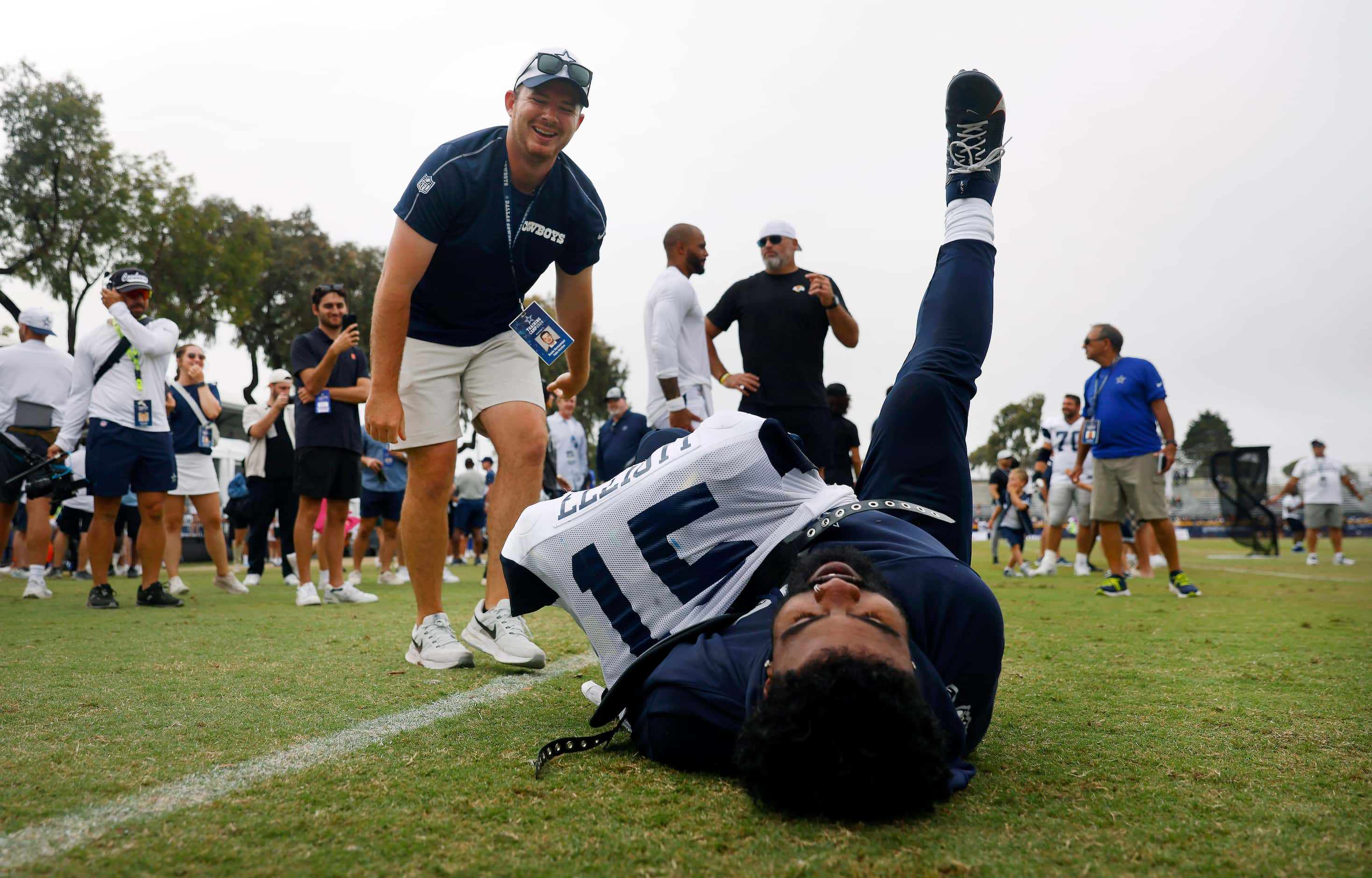 Dallas Cowboys running back Ezekiel Elliott (15) falls over in exasperation after Public...