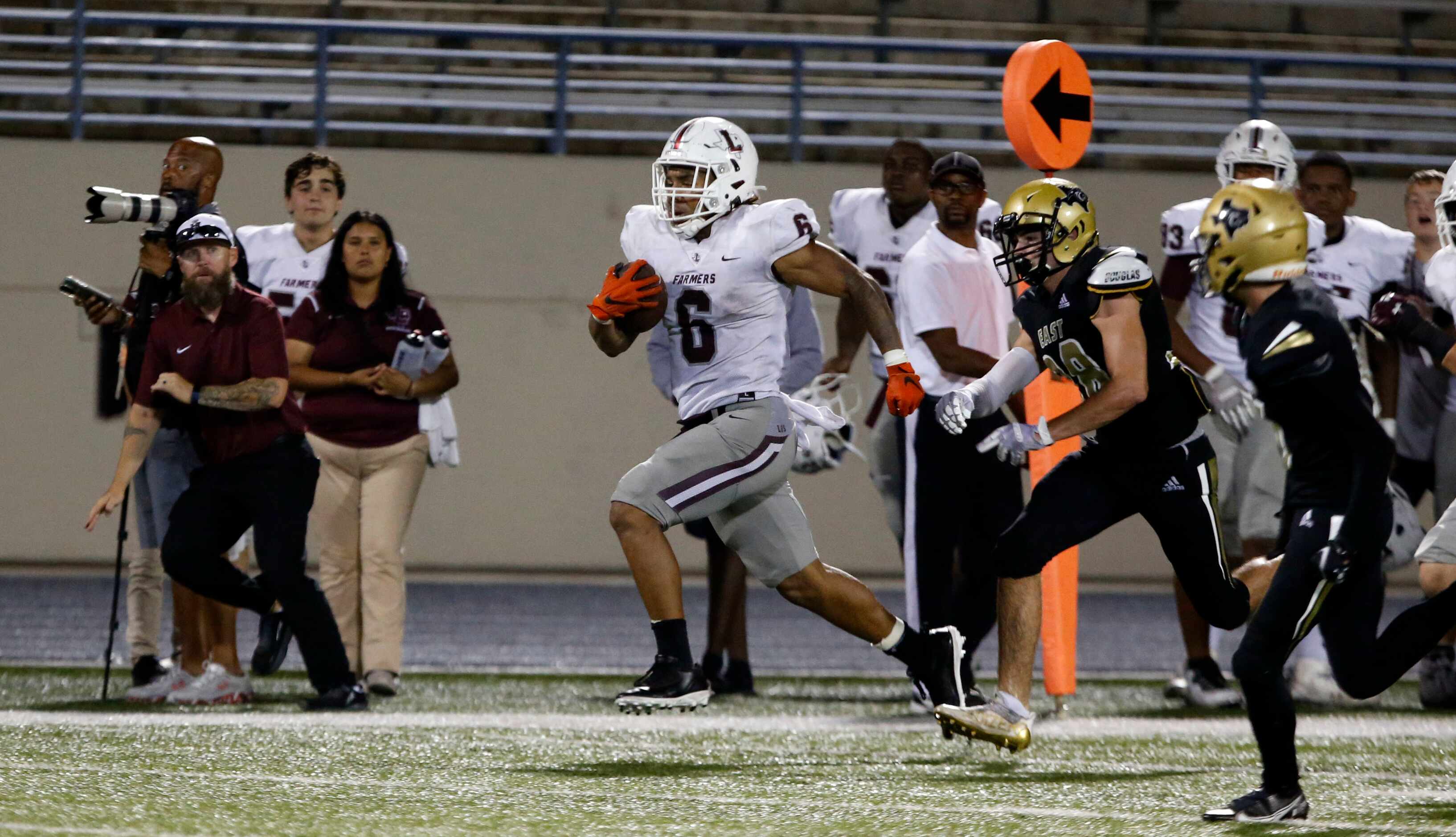 Lewisville RB Damien Martinez (6) heads to the end zone for another Farmers’ touchdown in a...