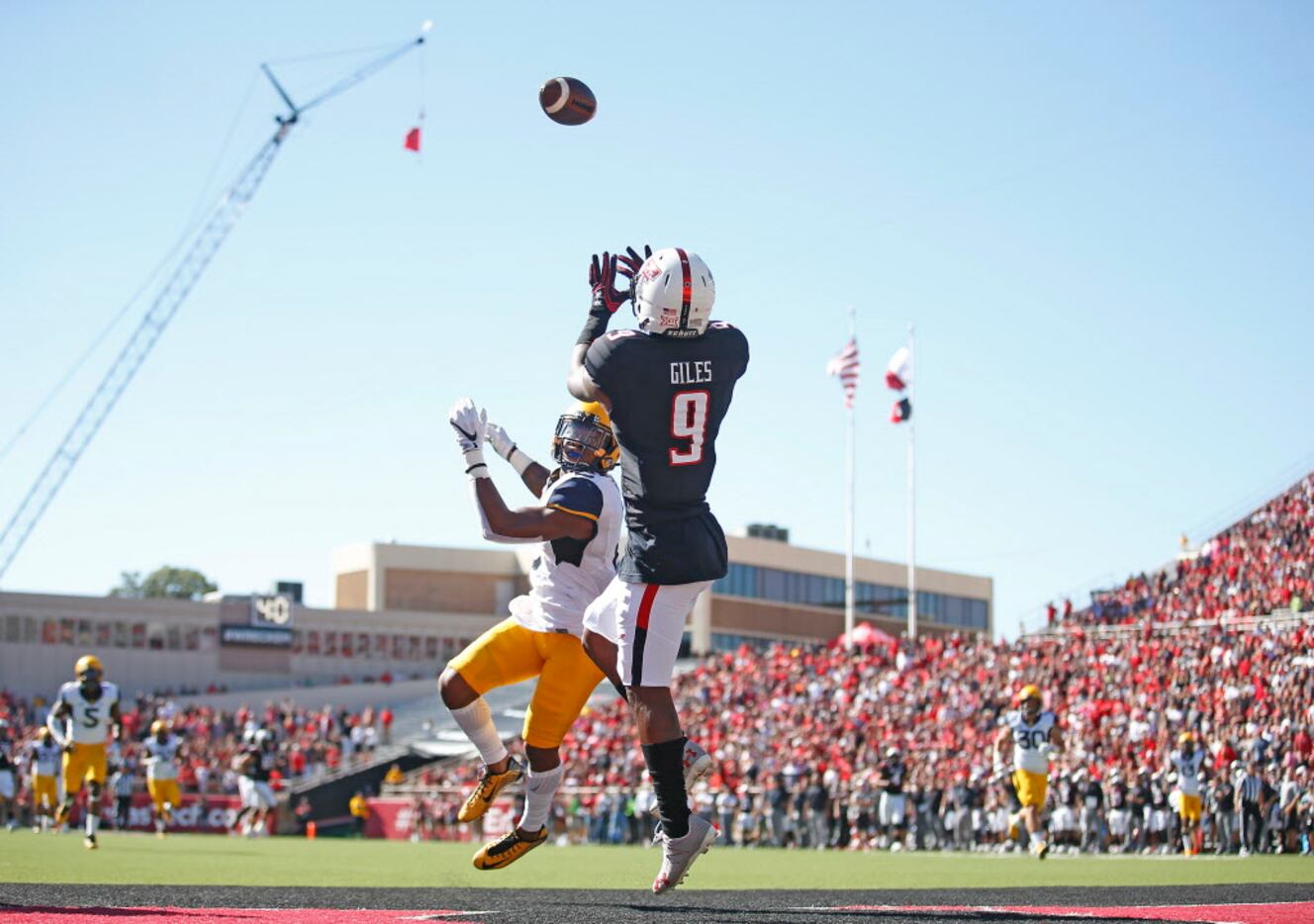 Texas Tech's Jonathan Giles (9) catches a touchdown pass against West Virginia during an...