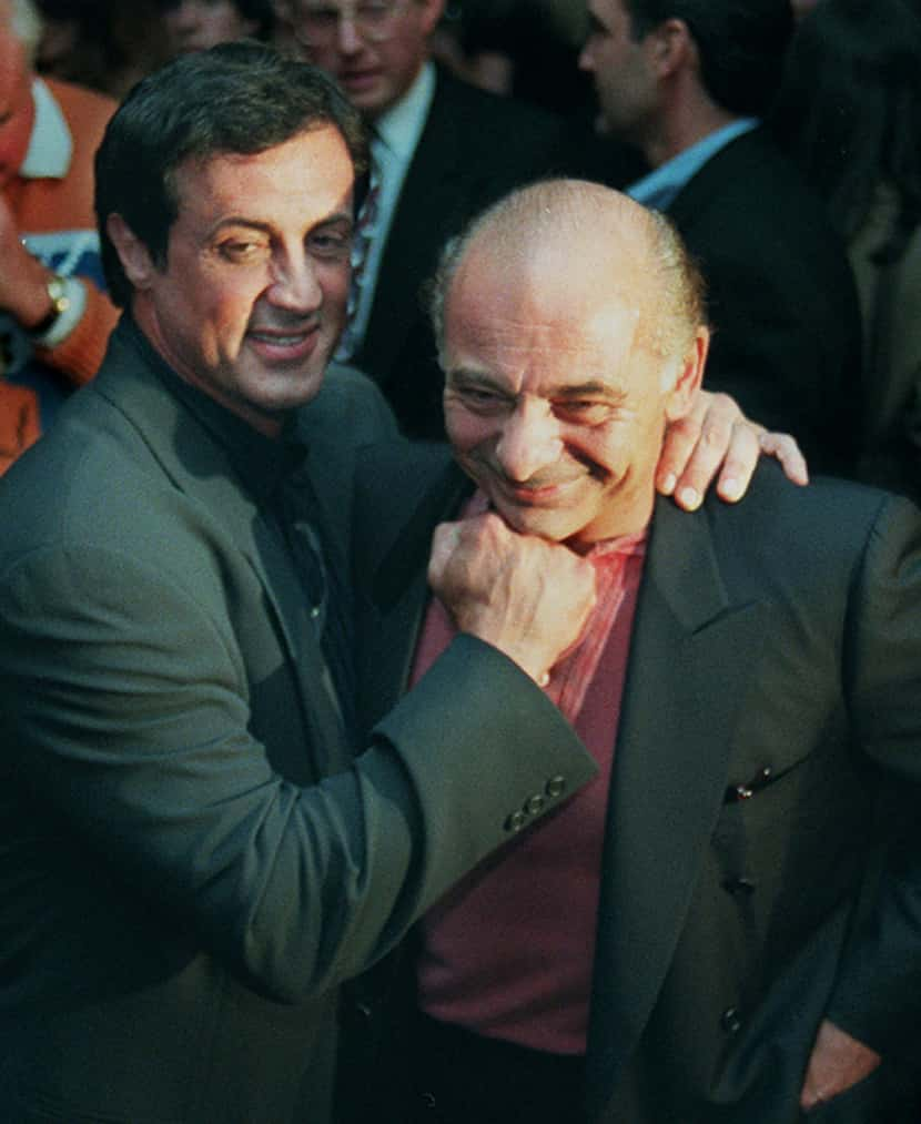 FILE - Sylvester Stallone, left, mugs with "Rocky" co-star Burt Young before a screening of...