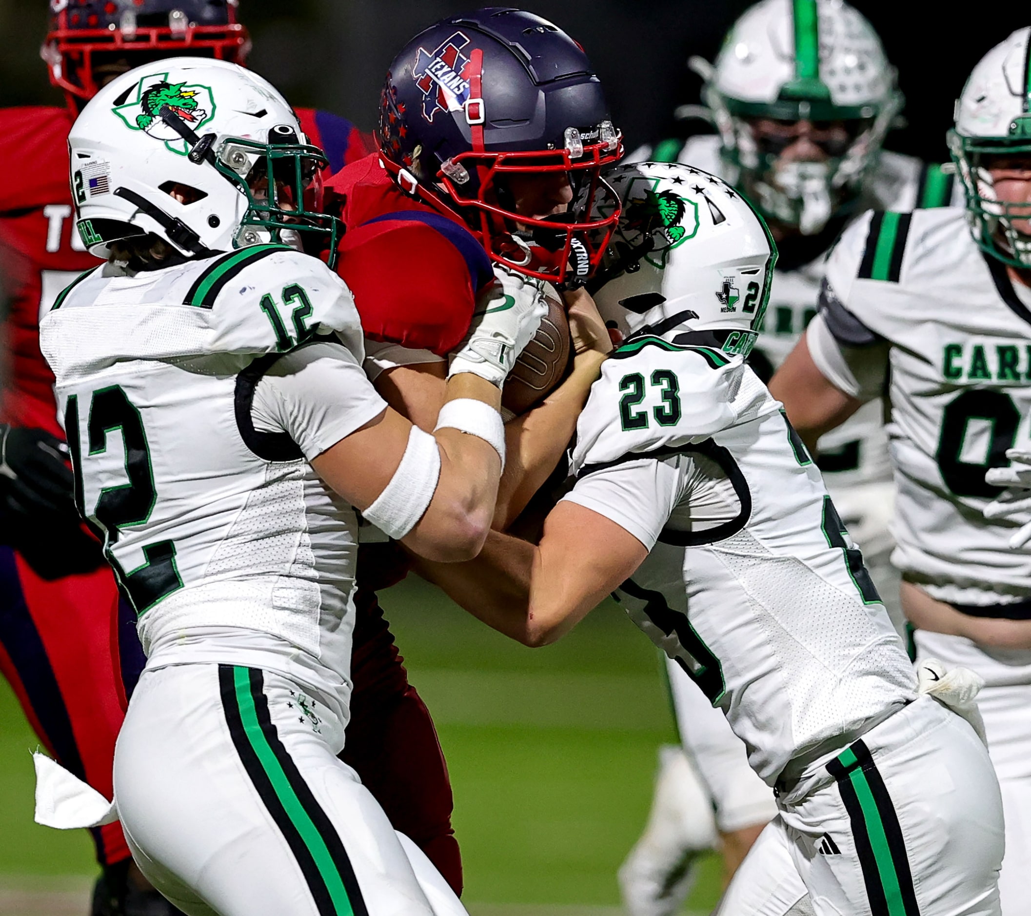 Justin Northwest quarterback Trey Poe stuffed by Southlake Carroll defensive back Austin...