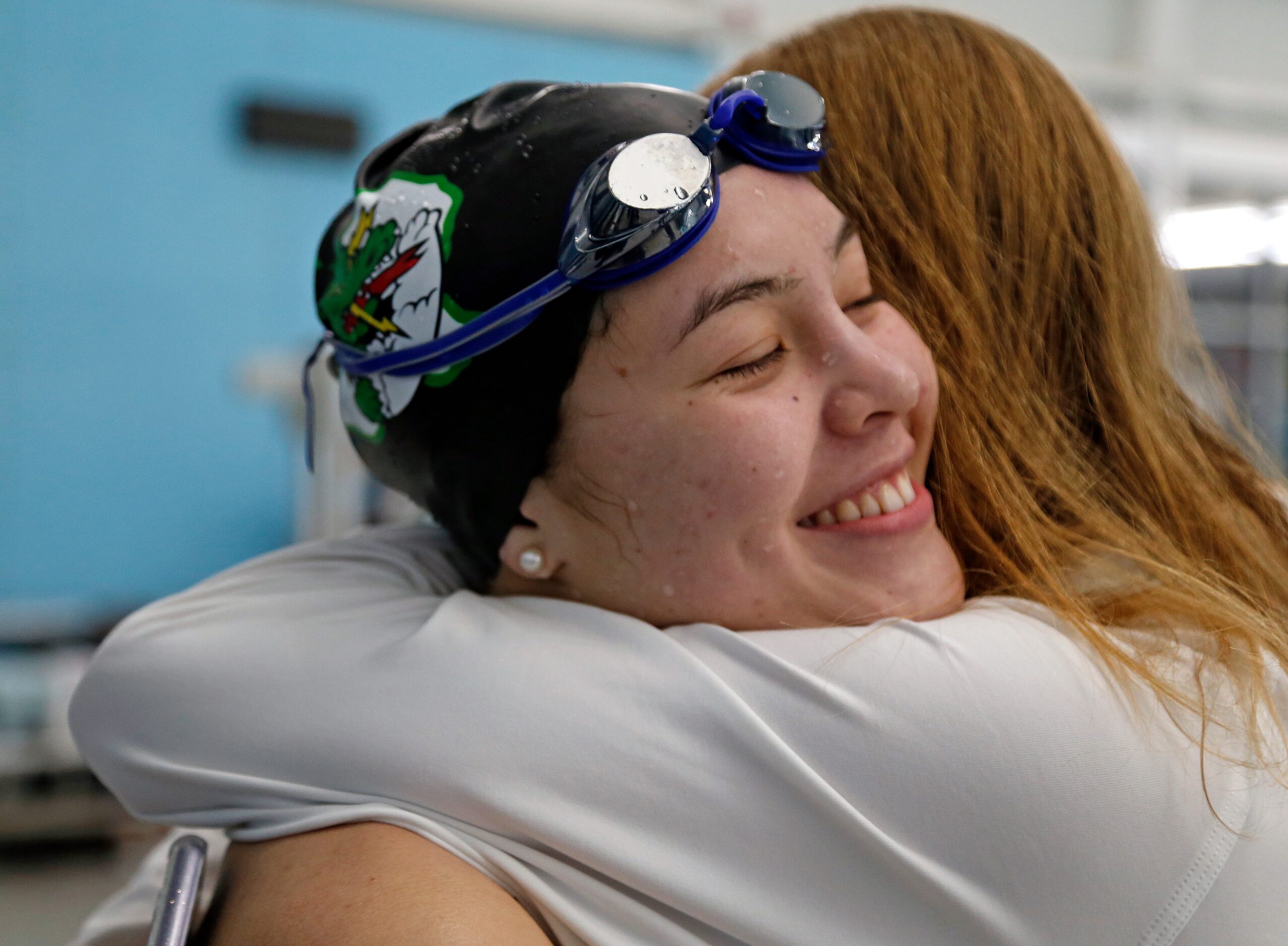 Corbyn Cormack, Southlake Carroll, is congratulated after winning in 100 yard butterfly in...