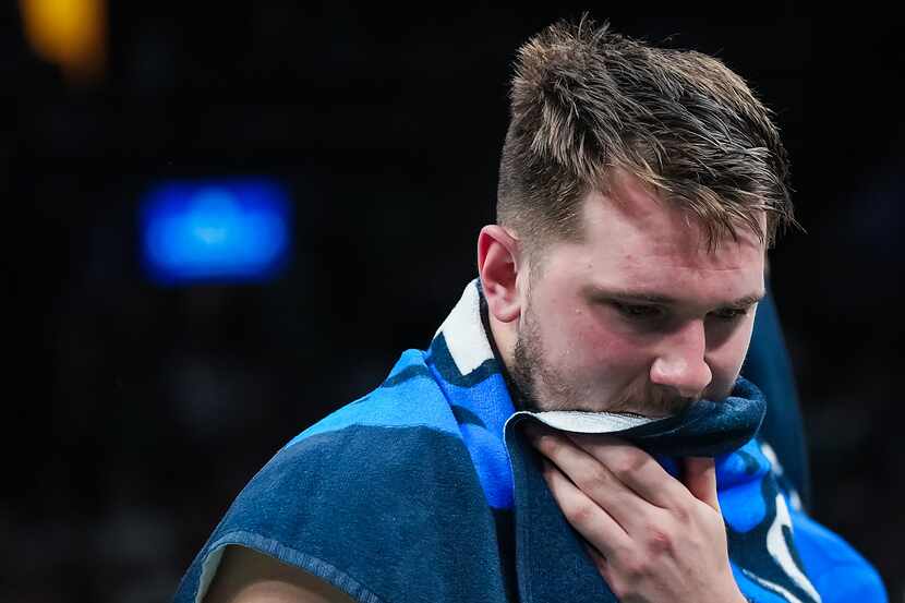 Dallas Mavericks guard Luka Doncic reacts  on the bench in the final minute of a loss to the...