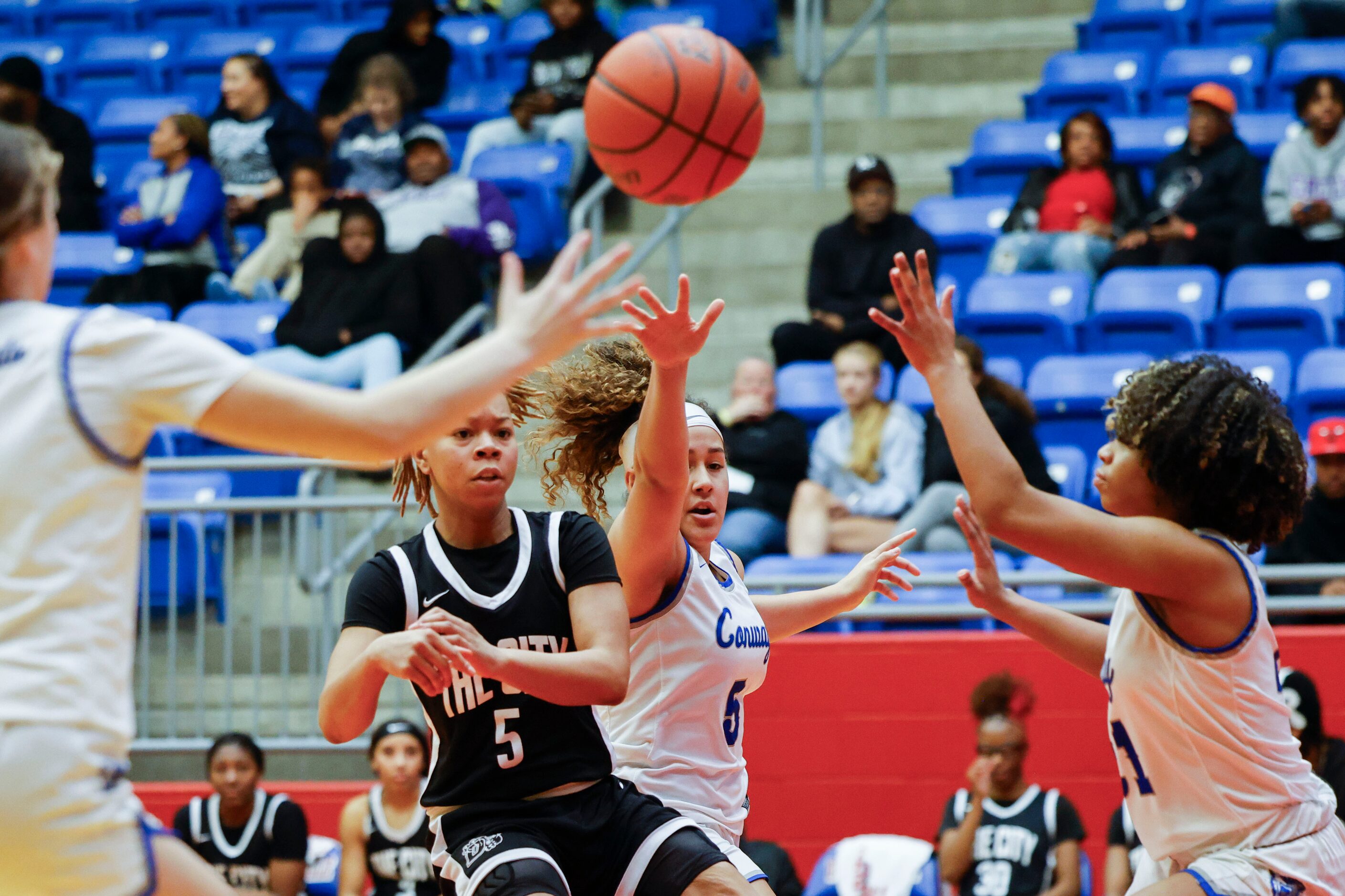 Duncanville high’s Laila Coleman (center left) passes the ball as Conway’s Nicole Rodriguez...