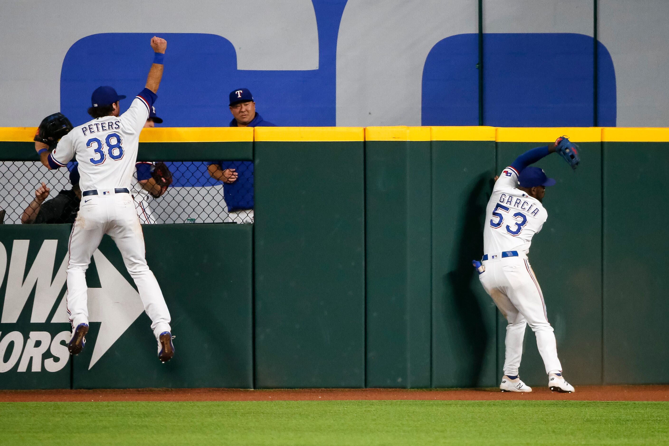 Texas Rangers center fielder DJ Peters (38) celebrates as Texas Rangers right fielder Adolis...