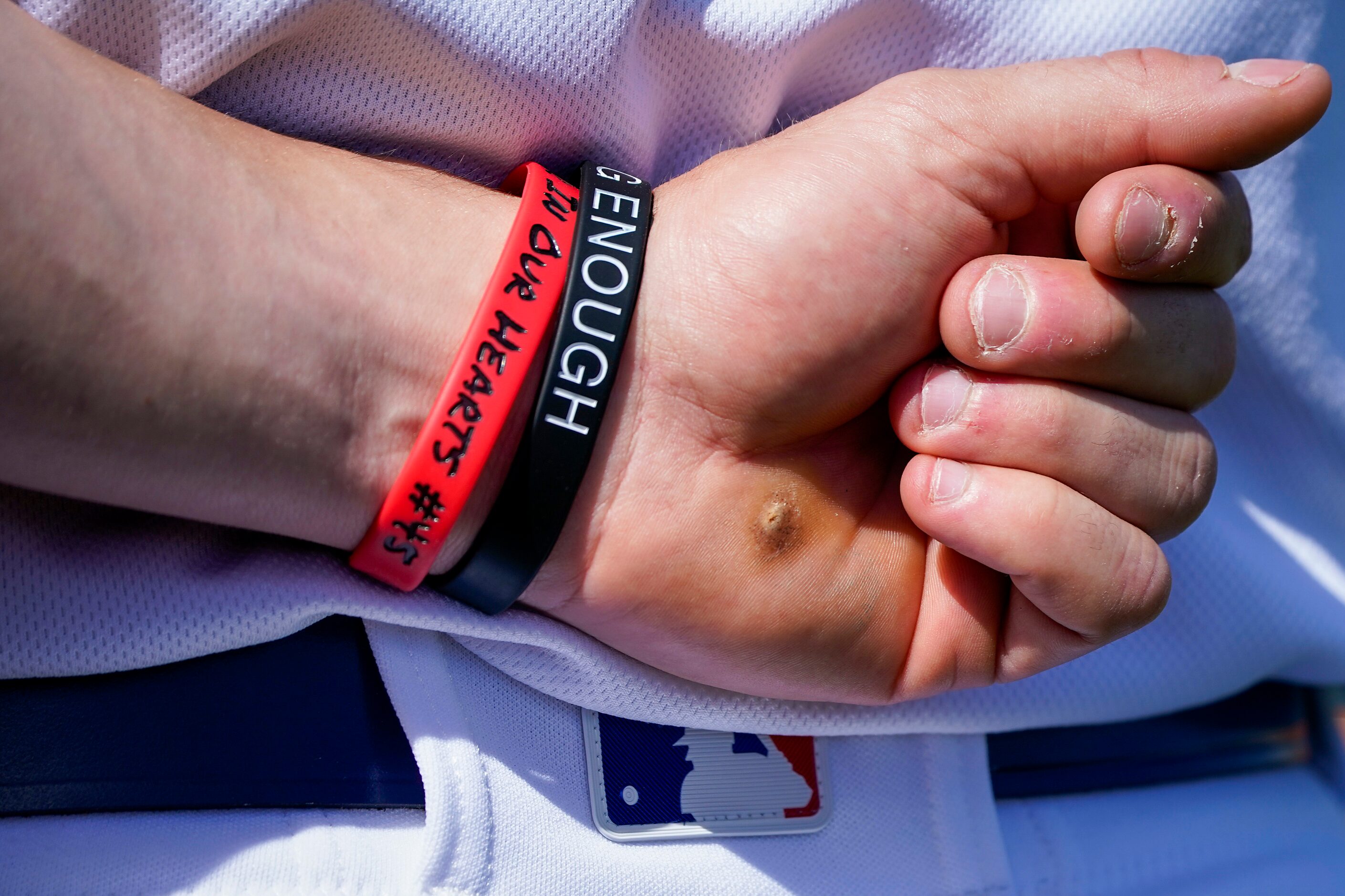 Texas Rangers outfielder Scott Heineman wears a wrist band in honor of late Los Angeles...