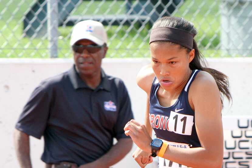McKinney Boyd's Aaliyah Miller bolts from the start enroute to her first place finish in the...