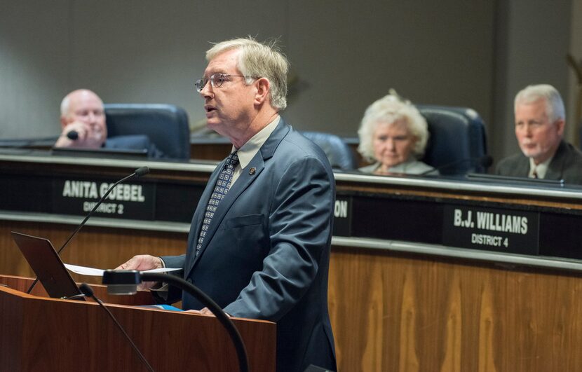 Garland Mayor Douglas Athas reads from his resignation letter before the start of the City...