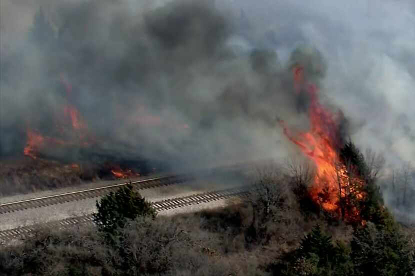 More than a dozen North Texas fire departments worked to put out a  significant  grass fire...