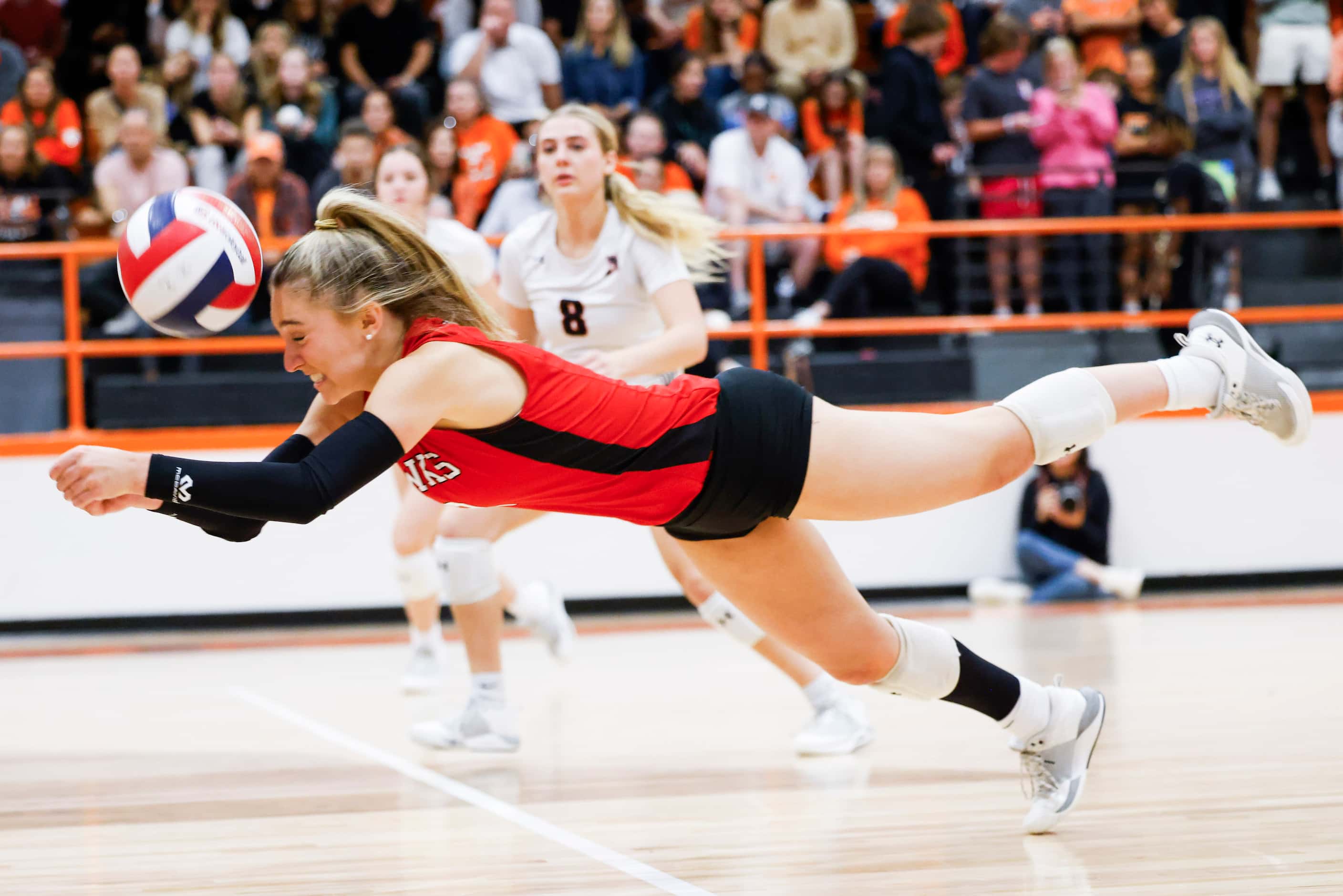 Rockwall heath’s Reese Ruecker dives for a hit during a volleyball game against Rockwall...
