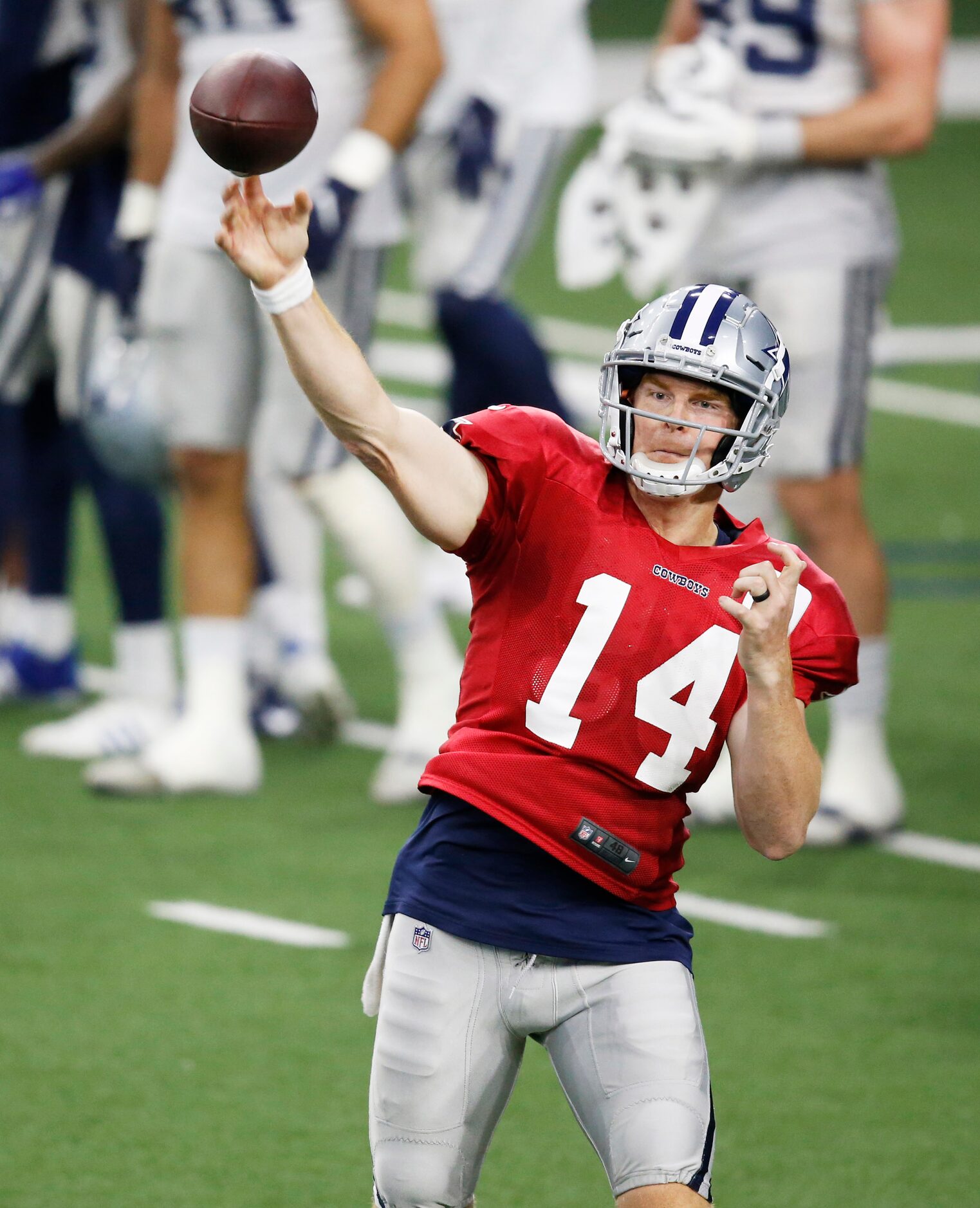 Dallas Cowboys quarterback Andy Dalton (14) attempts a pass in practice during training camp...