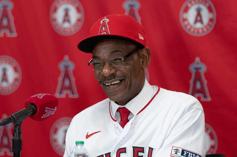 Ron Washington, the new manager of the Los Angeles Angels, smiles during a baseball news...