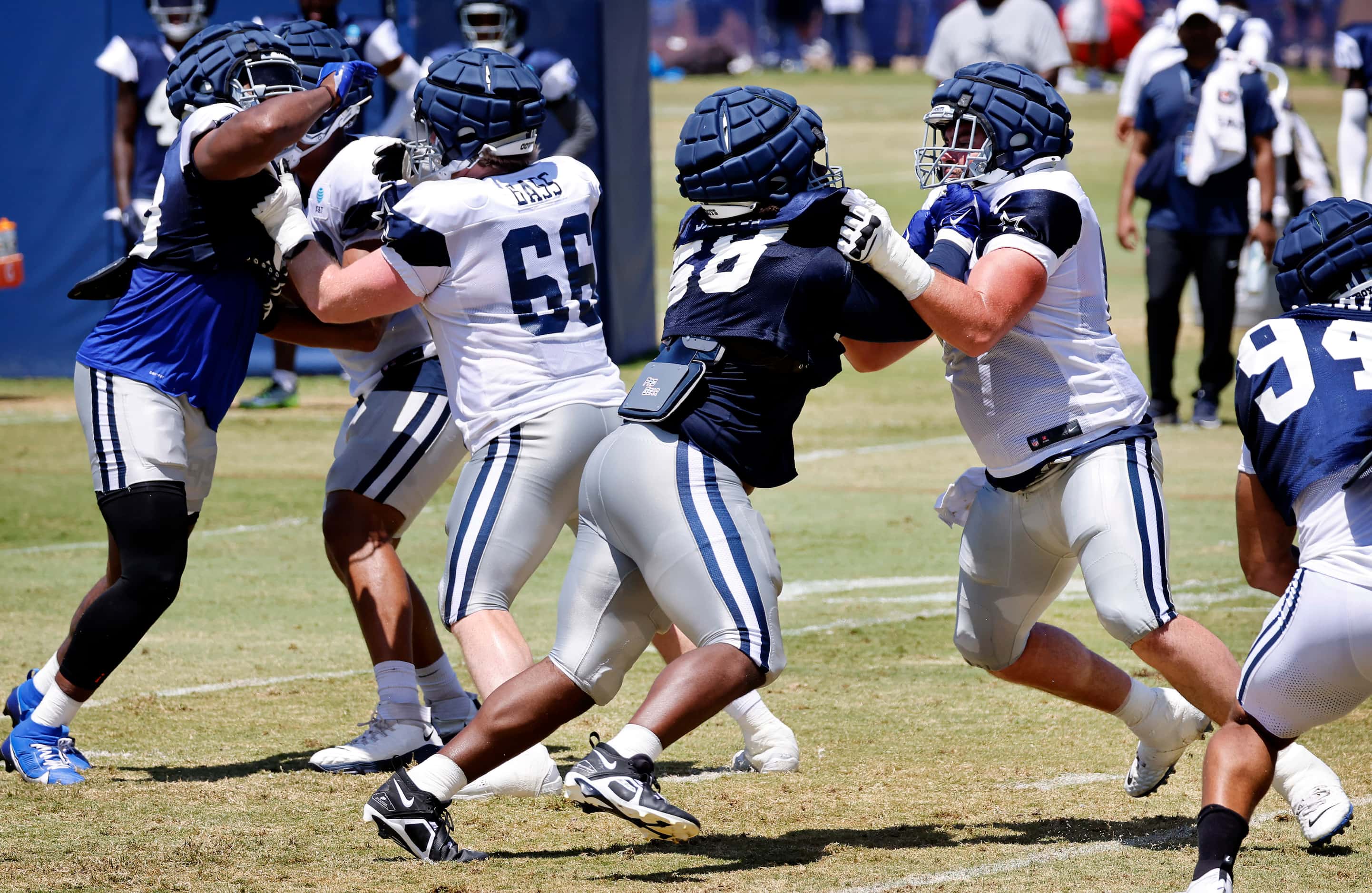 Dallas Cowboys defensive tackle Mazi Smith (58) pushes on center Brock Hoffman (67)  as he...
