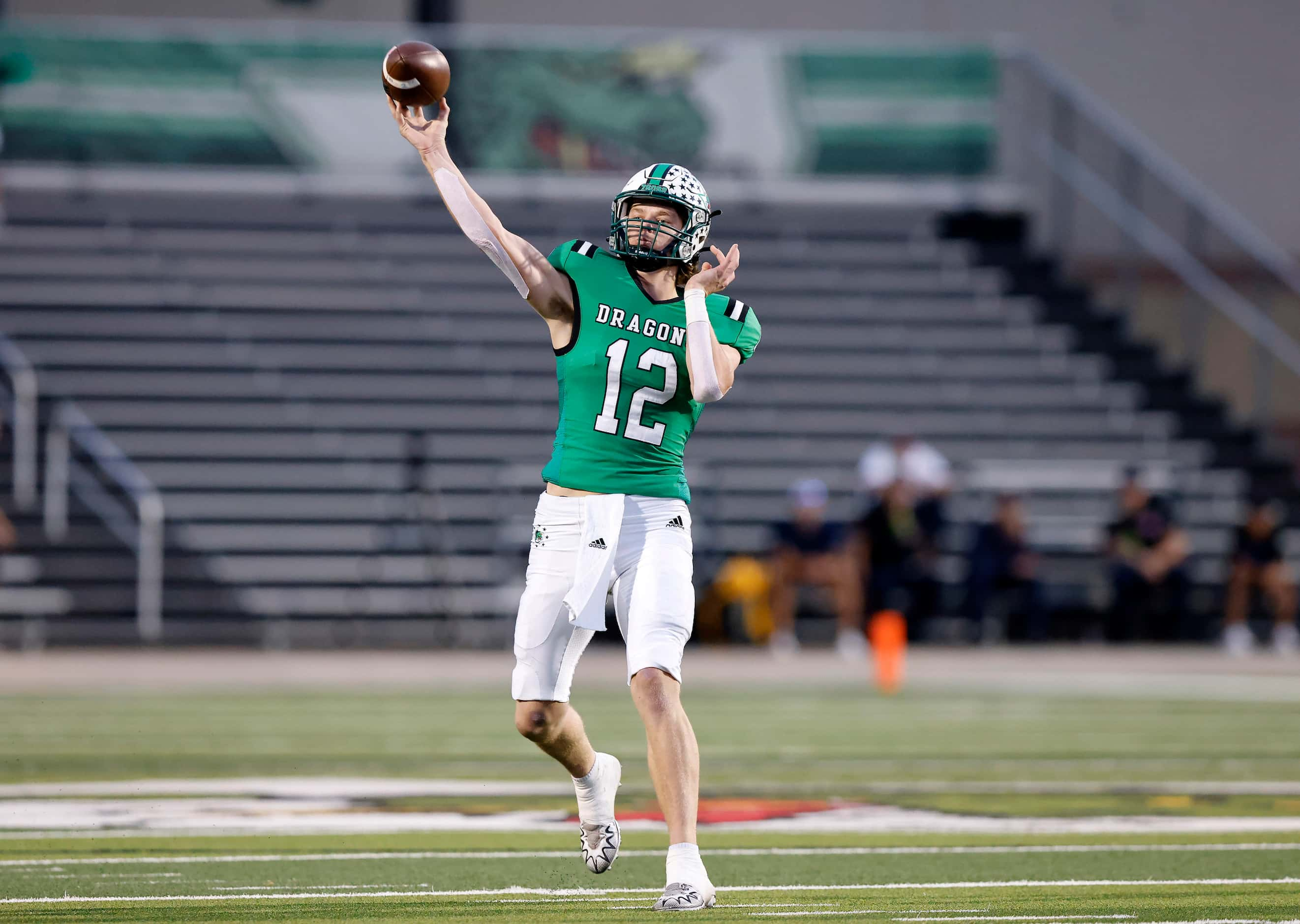 Southlake Carroll quarterback Kaden Anderson (12) throws a first quarter touchdown pass...