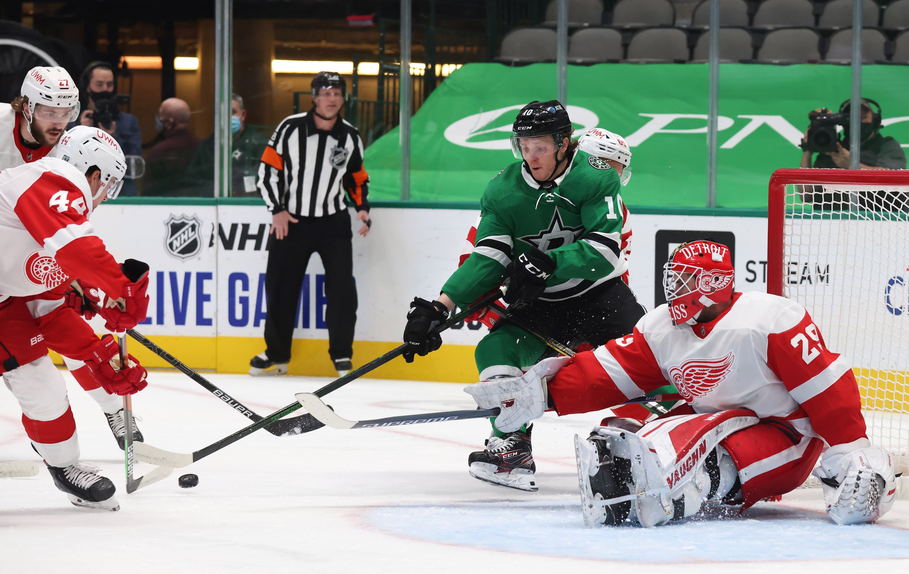 Dallas Stars Ty Dellandrea (10) looks to shoot as Detroit Red Wings defenseman Christian...