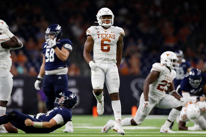 HOUSTON, TX - SEPTEMBER 14:  Juwan Mitchell #6 of the Texas Longhorns celebrates after...