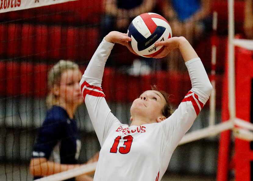 McKinney Boyd High School setter Camryn Weldon (13) makes a set on the run during game two...