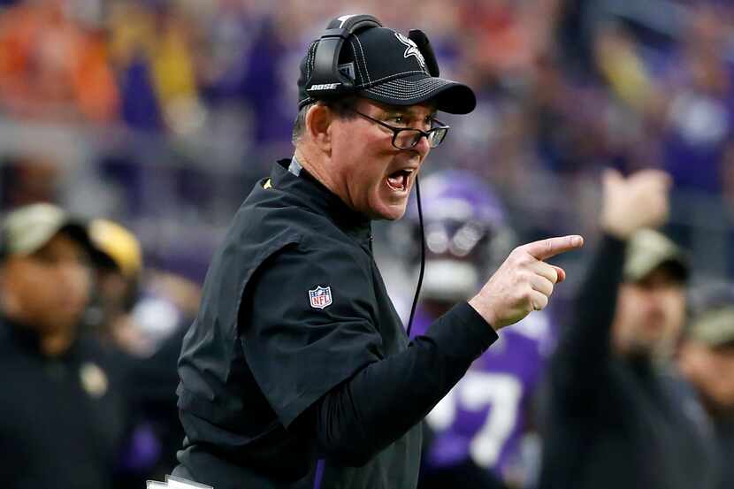 Minnesota Vikings head coach Mike Zimmer reacts to a call during the first half of an NFL...