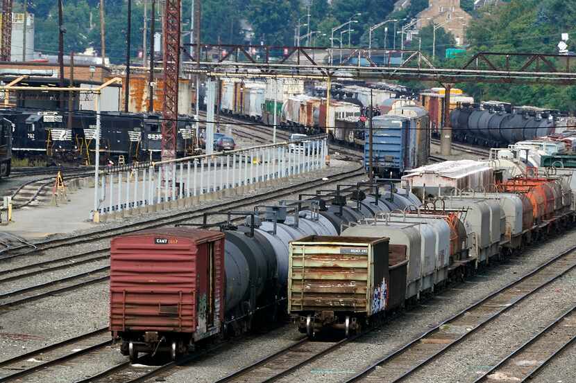 Freight cars wait to be hauled out of a Norfolk Southern terminal in Conway, Pa.