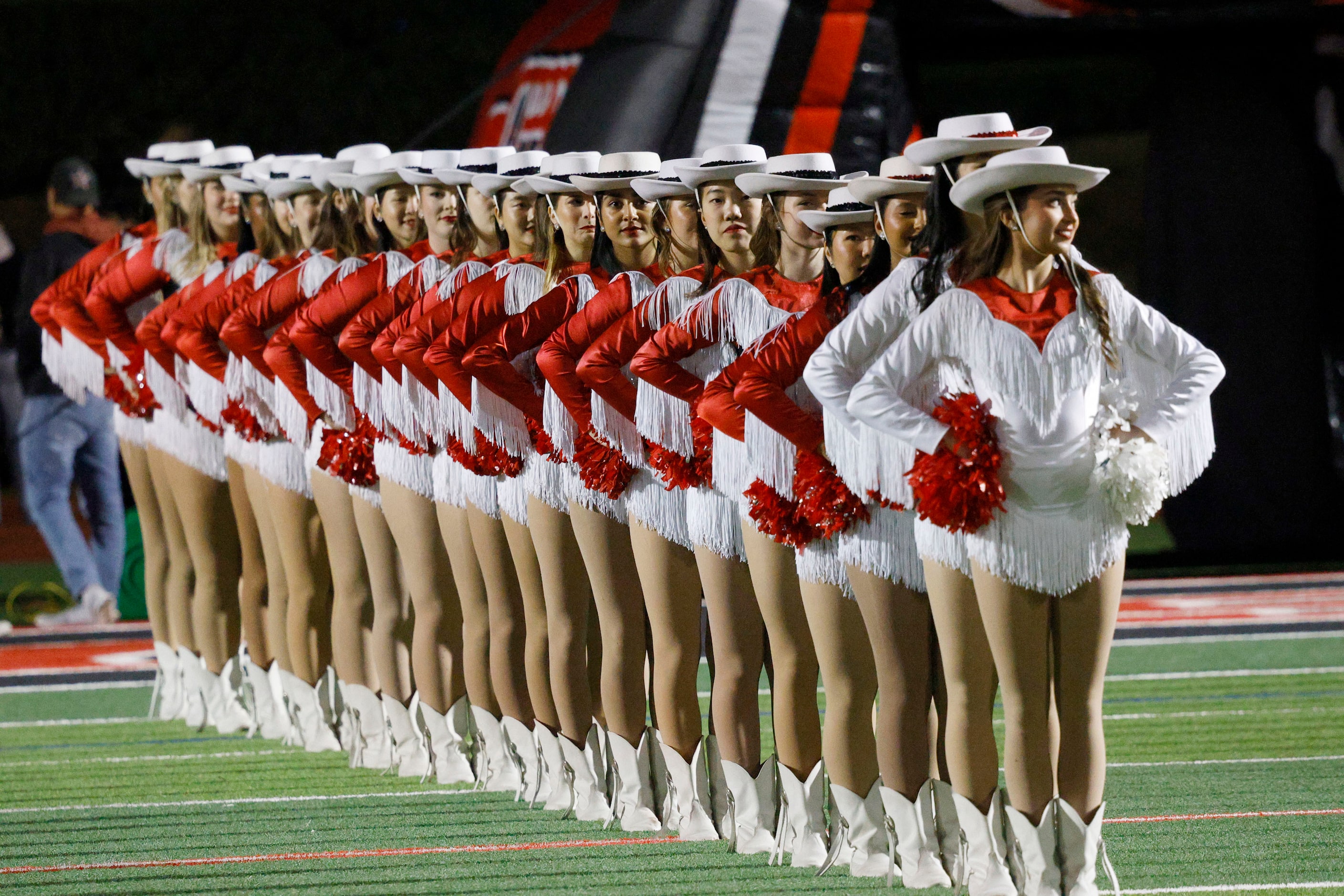 Coppell dance team members line up before a high school football game against Prosper at...