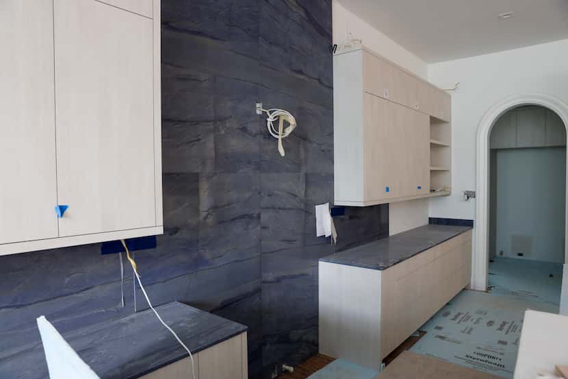 Azul macaubas lines the counters and backsplash in the kitchen.